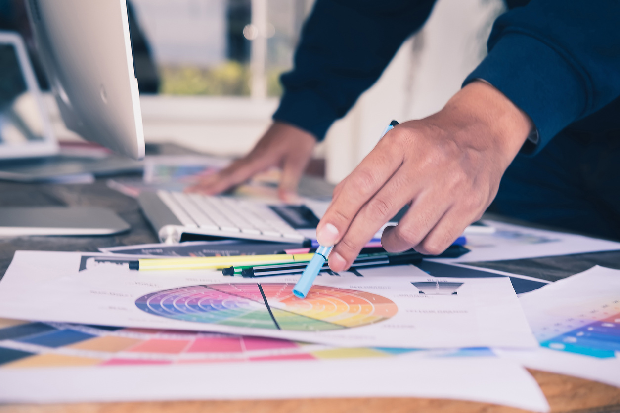 Close Up of Web Designer Choosing Colors on Palette
